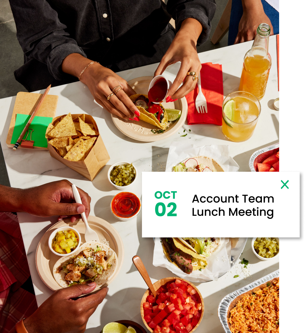 People eating a taco spread and an overlayed meeting notification 